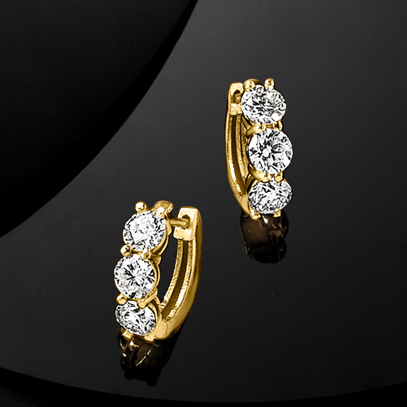 14kt yellow gold huggie hoop earrings with three round diamonds, side profile