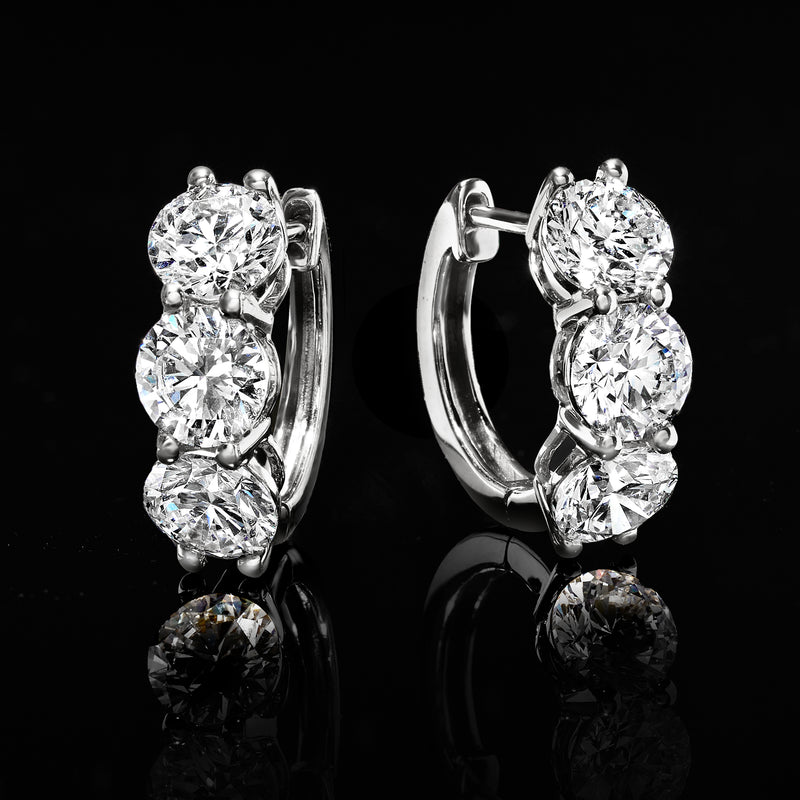 14kt white gold huggie hoops with three round prong-set lab-grown diamonds