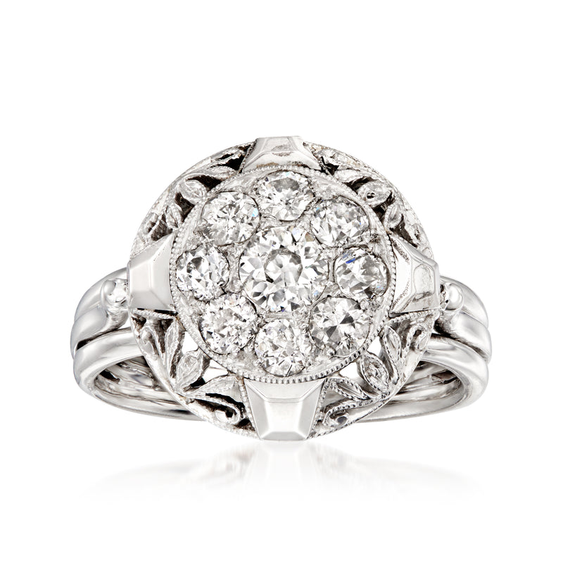 Vintage diamond cluster ring with round center stone, filigree detail, in platinum and white gold
