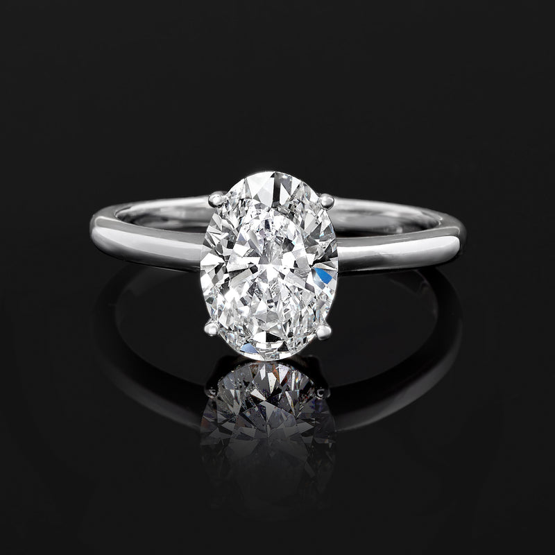 Oval diamond solitaire ring in 14kt white gold, front view with prong setting