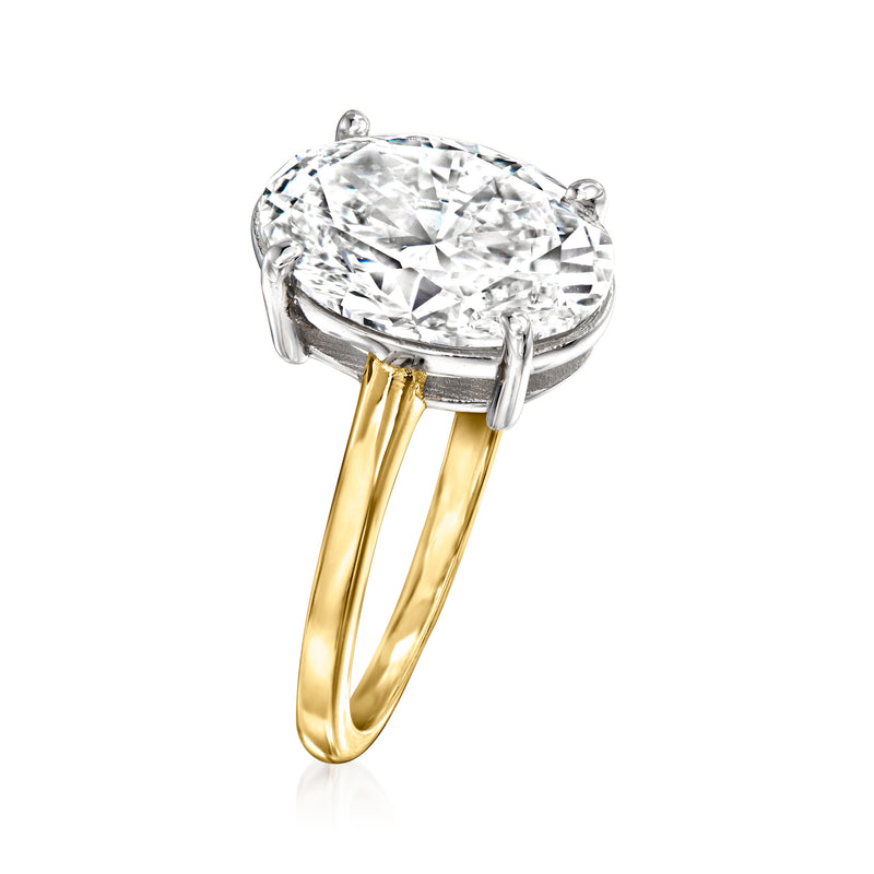 Oval diamond solitaire ring in 14kt yellow gold, side view with raised claw setting