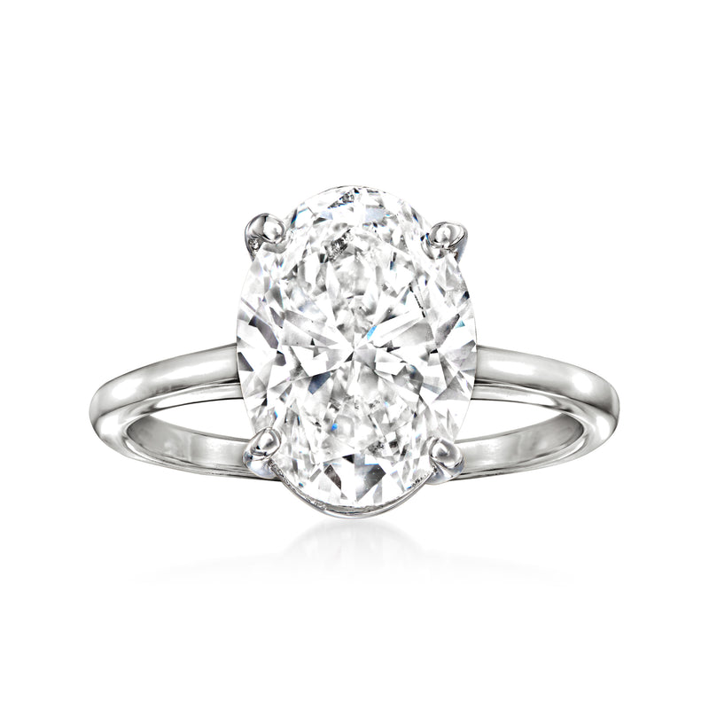 Oval diamond solitaire ring in 14k white gold with four prongs on a slim band