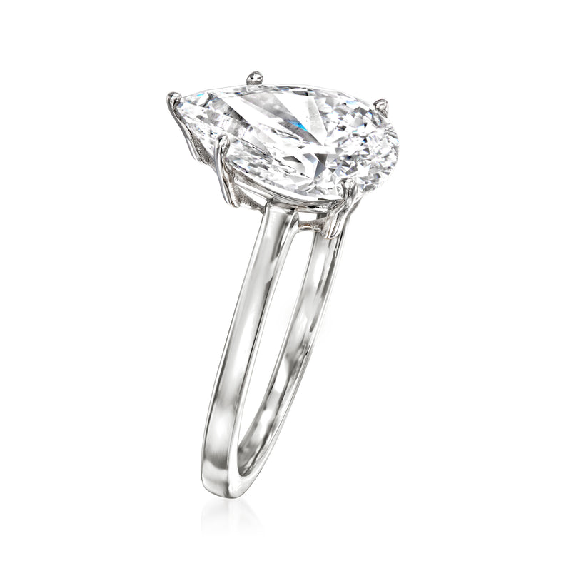 Pear-shaped diamond solitaire ring with white gold band, side view of prongs