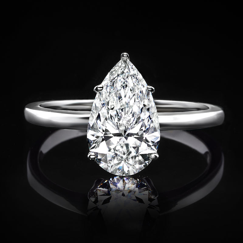 Pear-shaped diamond solitaire ring, bright teardrop stone with slim white gold band