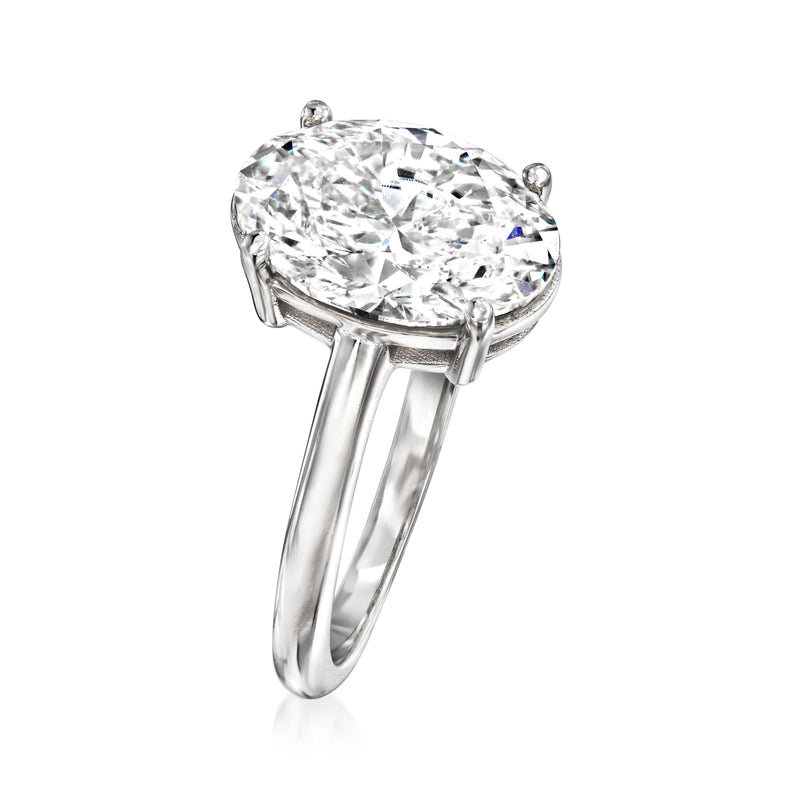 Oval diamond solitaire ring, white gold band with prongs; side view