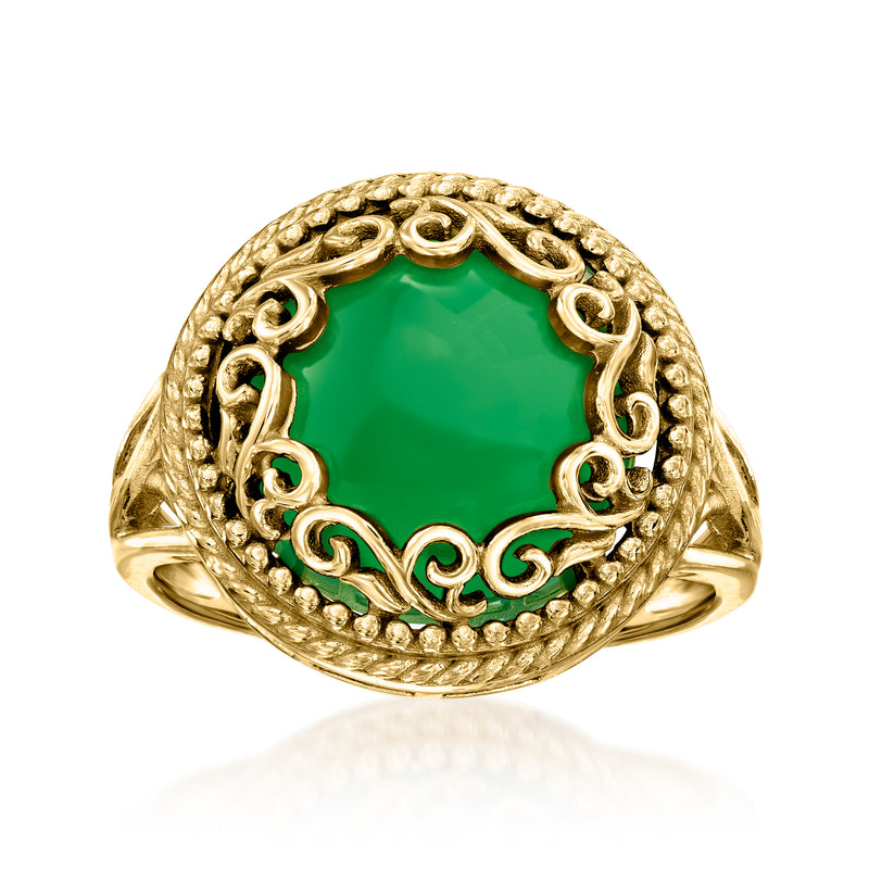 Gold-tone ring with green oval gemstone and ornate openwork bezel