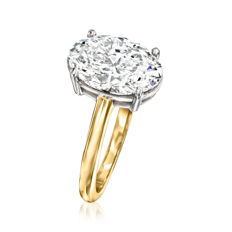 Oval diamond solitaire ring in 14kt yellow gold, side view of prongs and band