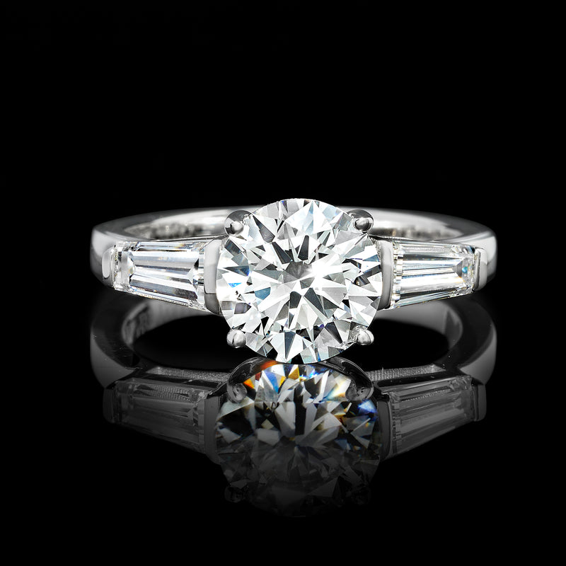 Lab-grown diamond ring, round center stone flanked by baguette cut side stones