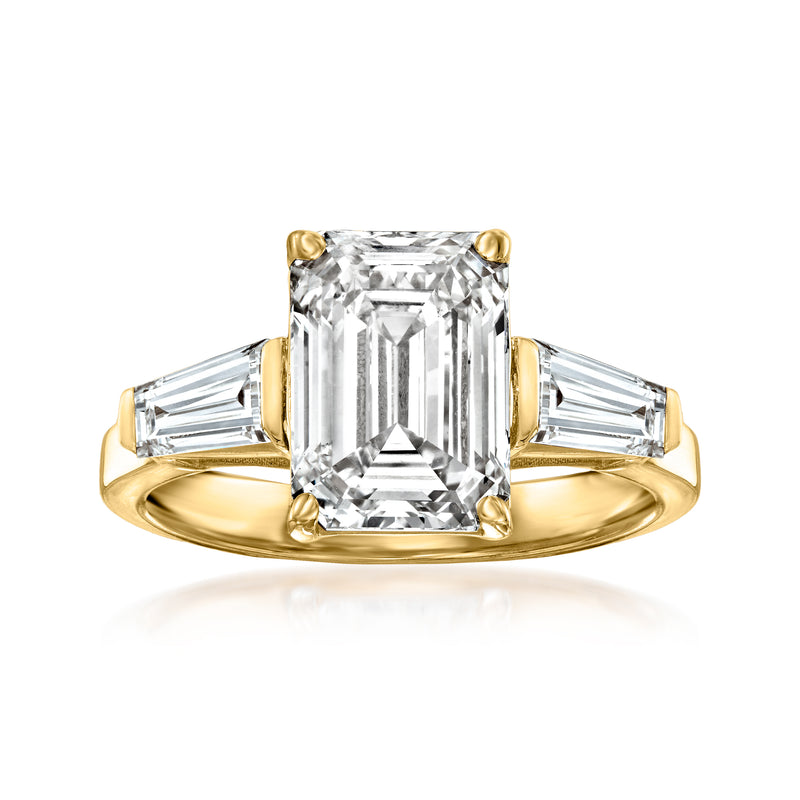 14kt yellow gold ring with a lab-grown diamond center stone and side baguettes