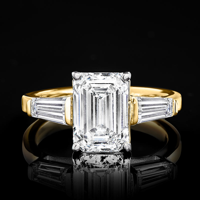 14kt yellow gold ring with rectangular step-cut lab-grown diamond and two side diamonds