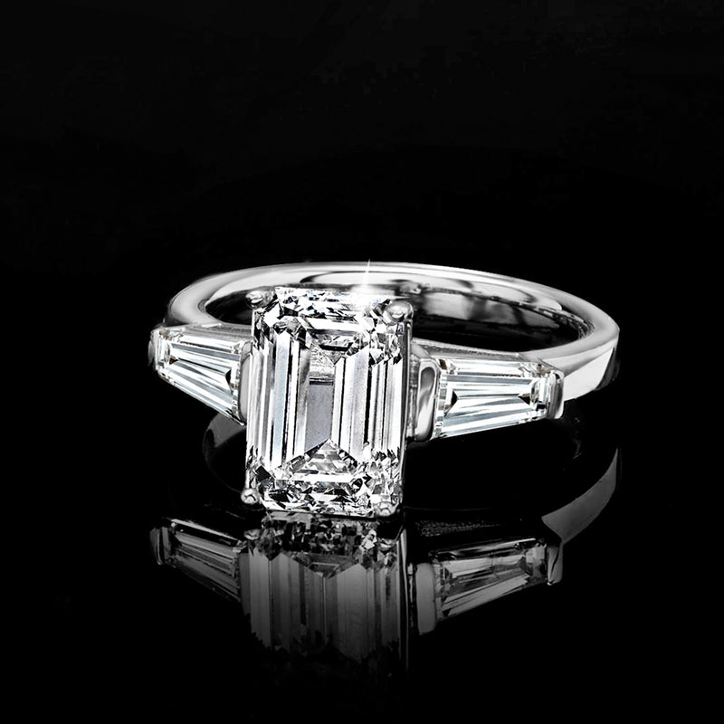 White gold lab-grown diamond ring with emerald-cut center and long baguette side stones