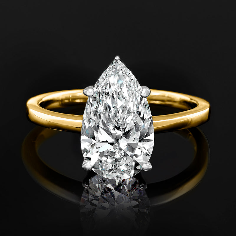 Pear-cut diamond solitaire ring in 14kt yellow gold, prong-set pear center stone