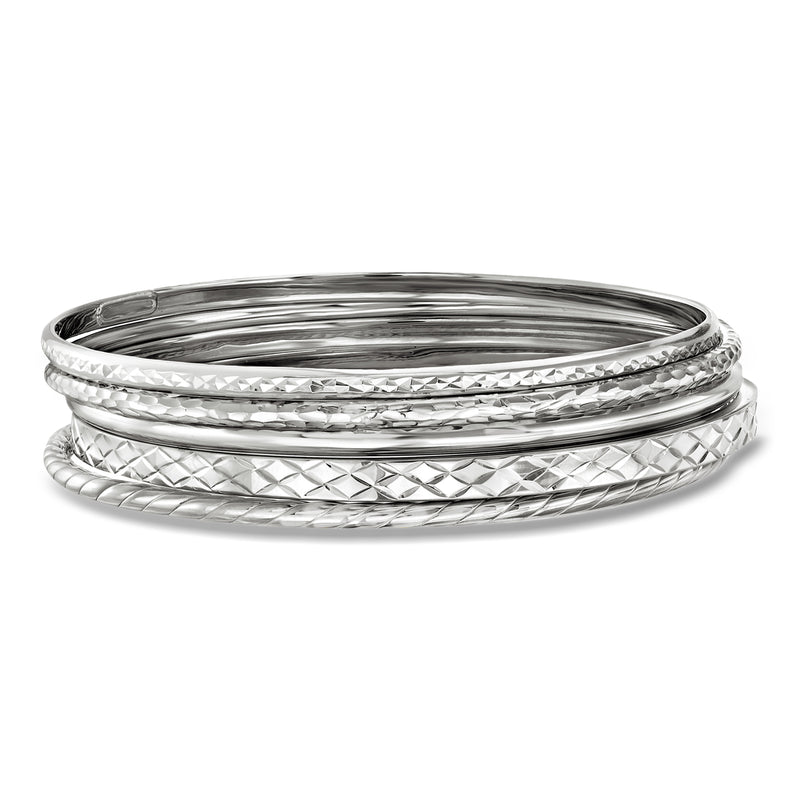 Sterling silver bangle set with five stacked diamond-cut and textured bracelets