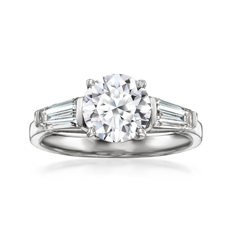 14kt white gold three-stone diamond ring with round center and baguette side stones