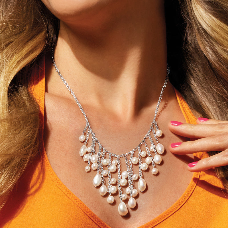 Cultured pearl fringe necklace on neckline with multi-drop dangling pearls