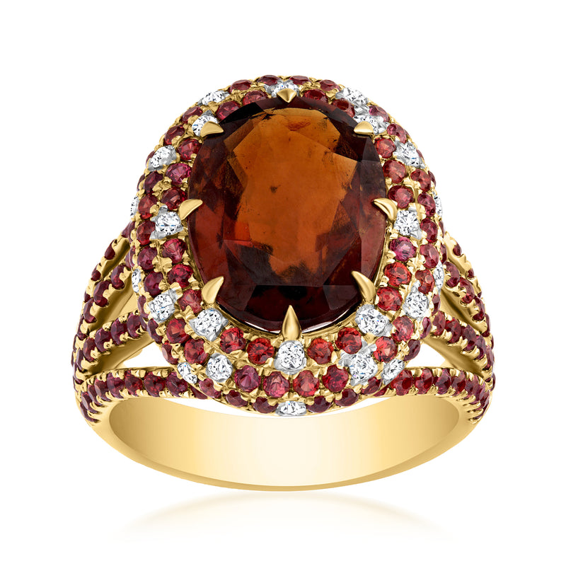 18kt yellow gold ring with oval orange gemstone, diamond and garnet halo