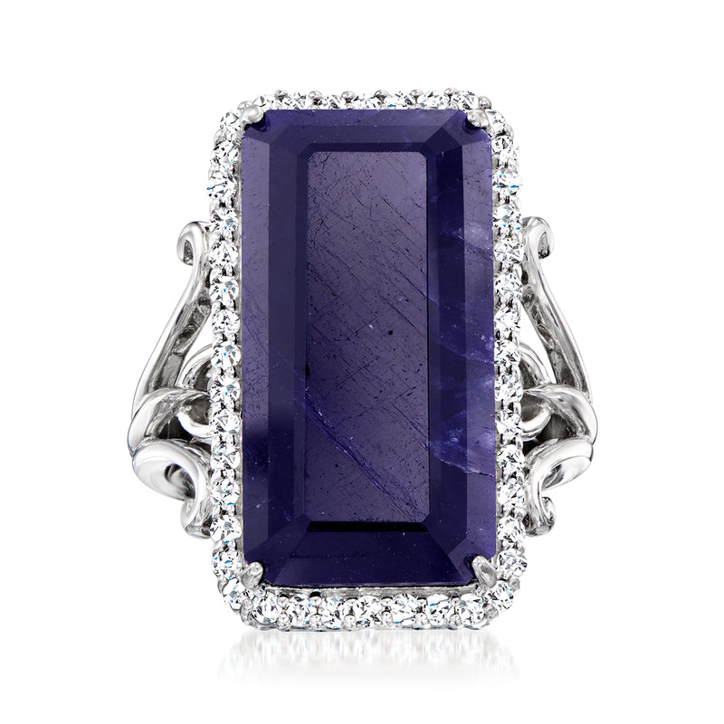Sterling silver ring with large rectangular dark purple sapphire and halo of white stones