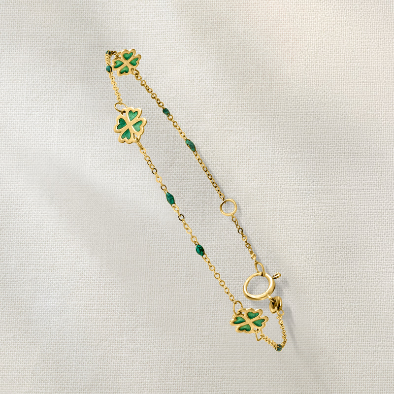 Gold chain bracelet with green enamel clover charms and link clasp