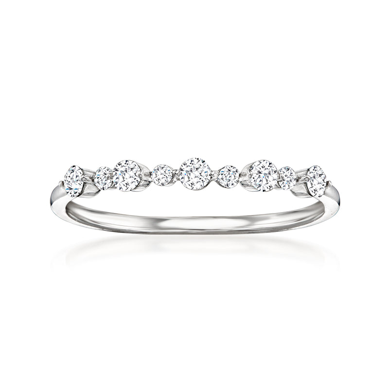 Sterling silver diamond ring with round bezel-set stones across the band