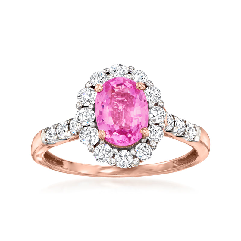 14kt rose gold ring with pink oval sapphire center and diamond halo and split shoulders