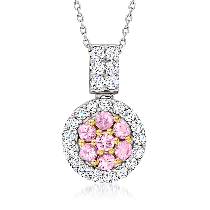 Gold pendant necklace with round pink sapphire center and diamond halo