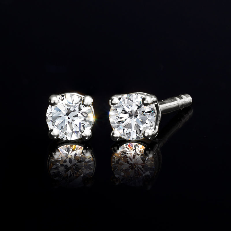 Round diamond stud earrings, four-prong sterling silver setting with post backs