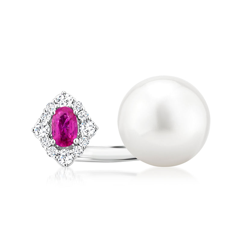 Open-space white gold ring with round white pearl, oval ruby center, diamond halo