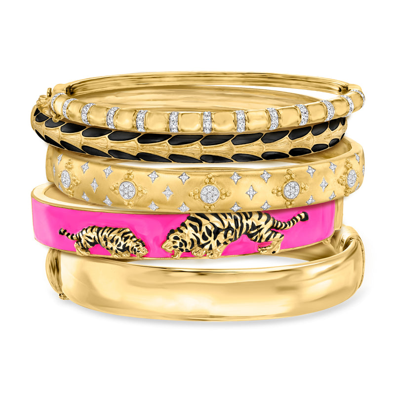 Five gold-tone bangles with crystal details, pink and black animal-print accents
