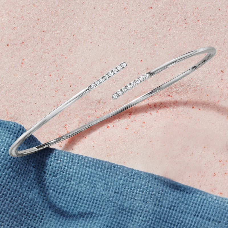 Sterling silver open bangle with two diamond-studded bars in bypass design