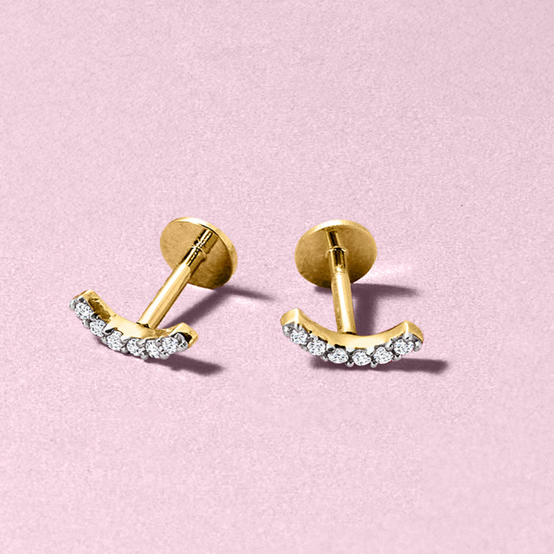 Curved bar diamond stud earrings in 14kt yellow gold with round flat backs
