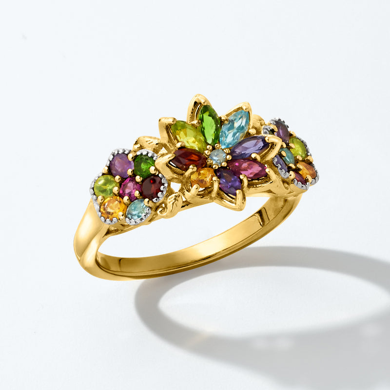 Gold multi-gem floral ring with prong-set purple, green, orange, and blue stones