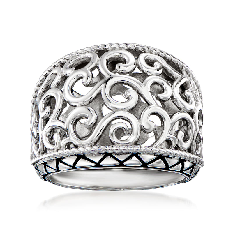 Sterling silver filigree ring with scrollwork top and black enamel accents