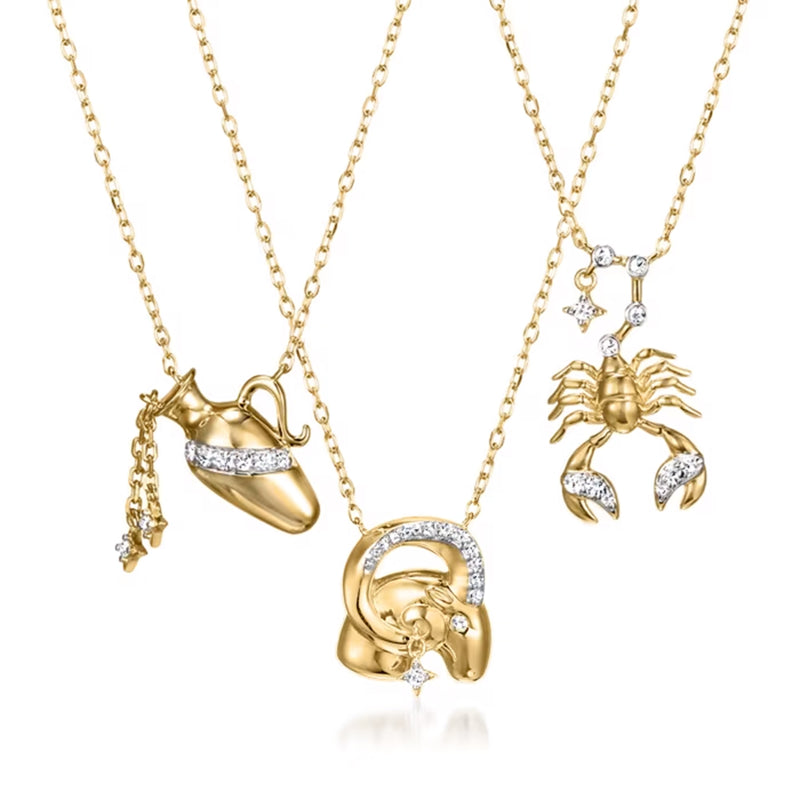 Gold-tone zodiac charm necklaces with diamond accents, multiple pendants on chain
