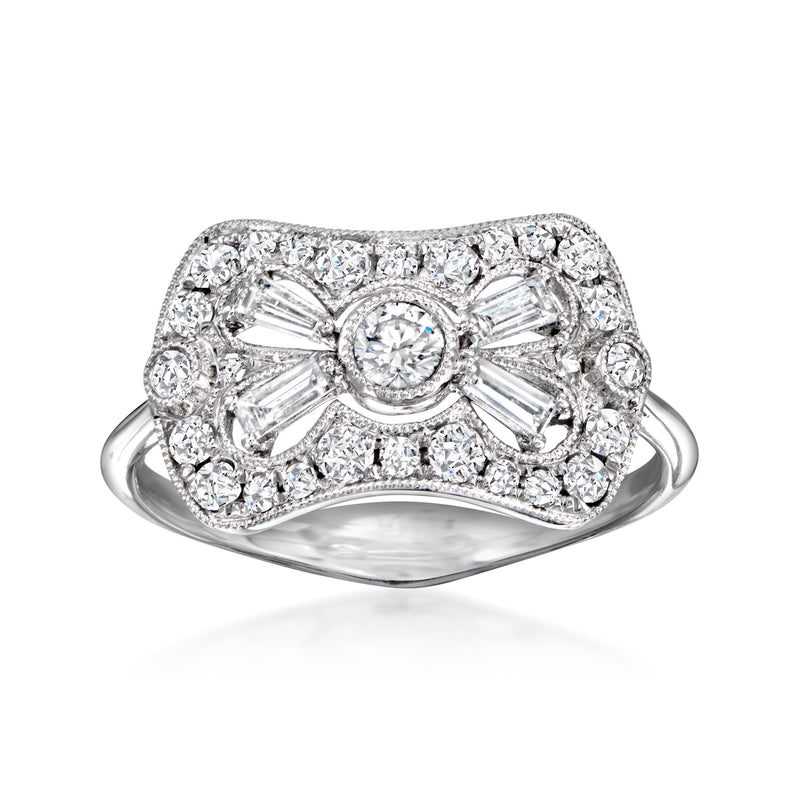 14kt white gold diamond milgrain ring with oval center and halo of baguette-style stones
