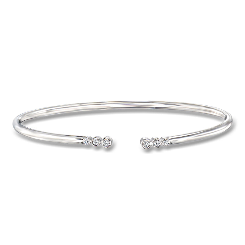 Sterling silver open-space cuff bracelet with bezel-set round diamonds at the ends
