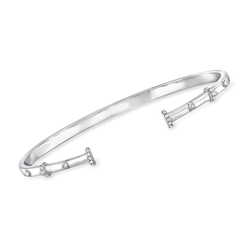 Sterling silver cuff bracelet with diamond station accents along the hinged band