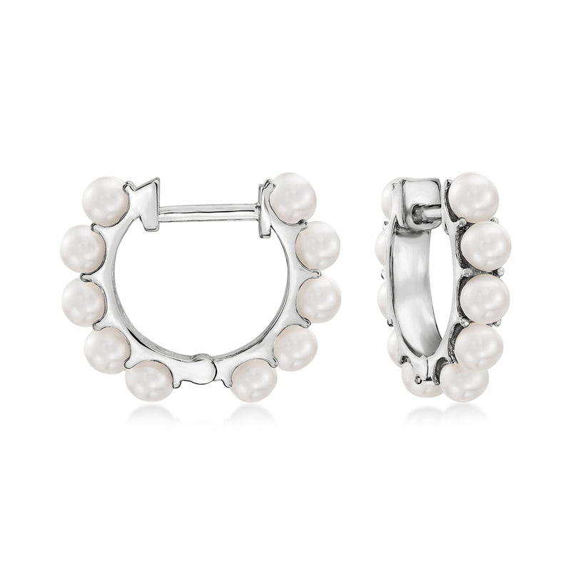Sterling silver pearl huggie hoop earrings with small round cultured pearls around the ring