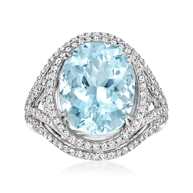 Oval light blue aquamarine halo ring with white-gold diamond accents