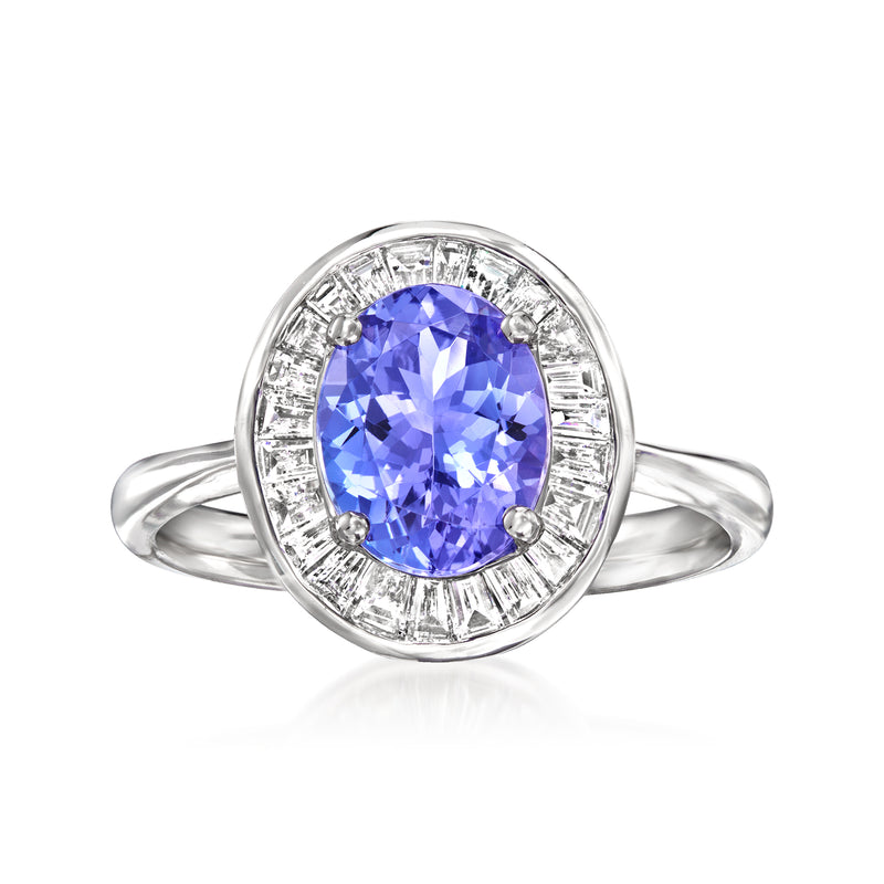 14kt white gold tanzanite ring with oval blue center stone and diamond halo