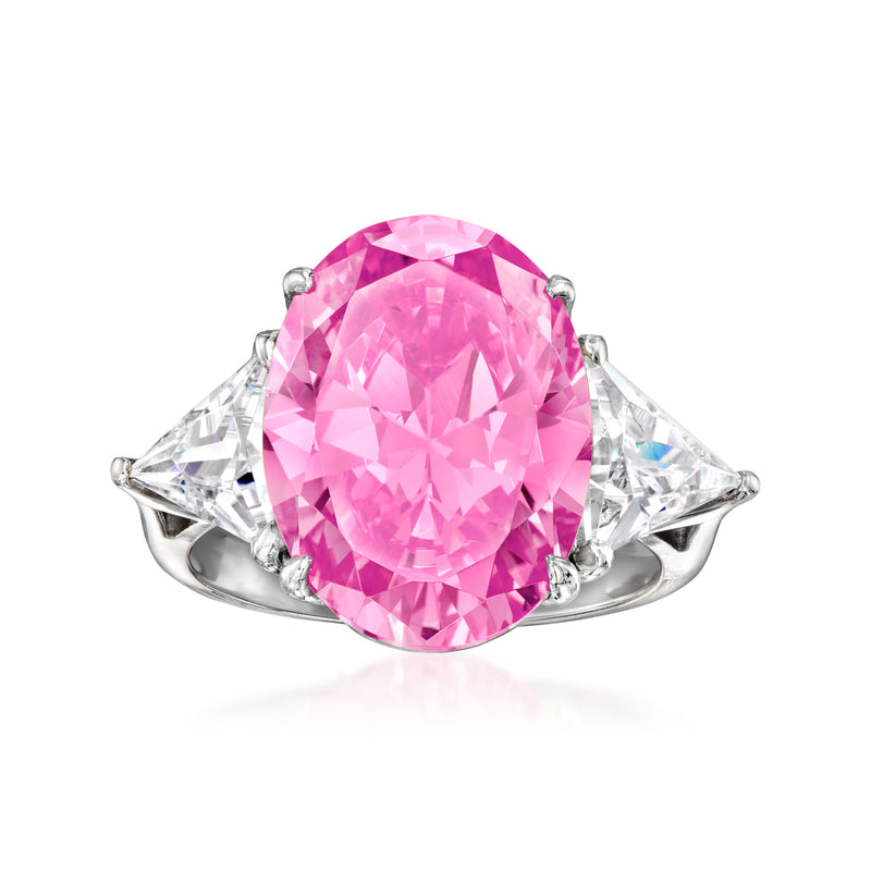 Sterling silver ring with oval pink center stone and two triangular clear side stones