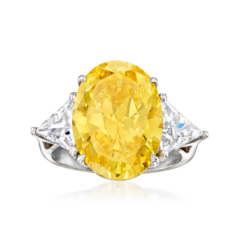 Sterling silver ring with oval yellow simulated sapphire center and two clear side CZs