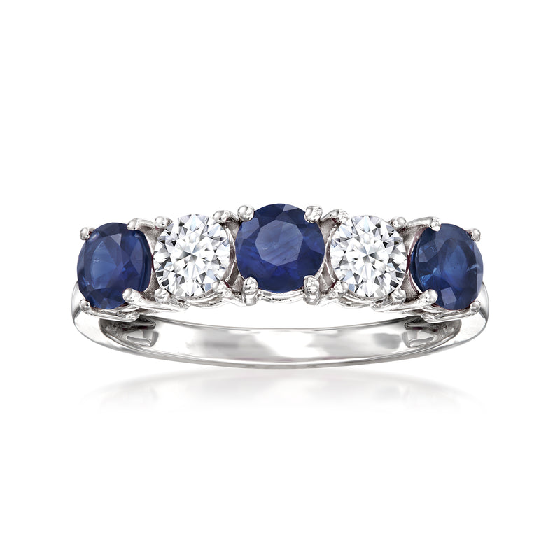 Sapphire and diamond ring in white gold with three deep-blue stones and two clear accents