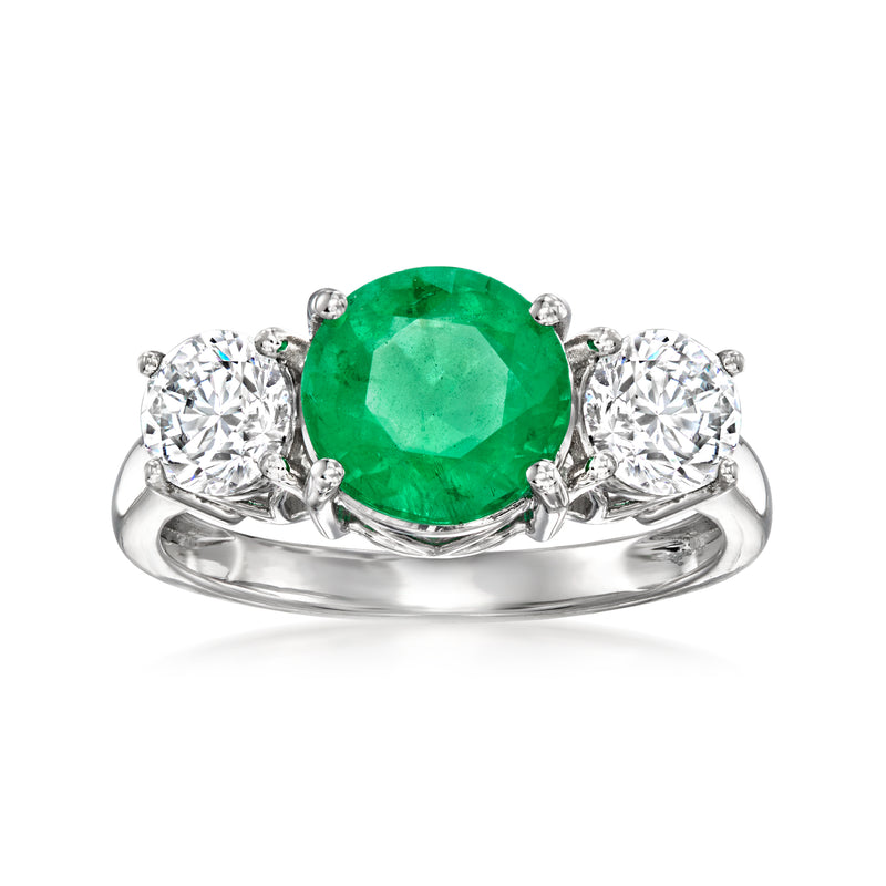 Emerald ring in 14k white gold with oval green center and round diamond accents