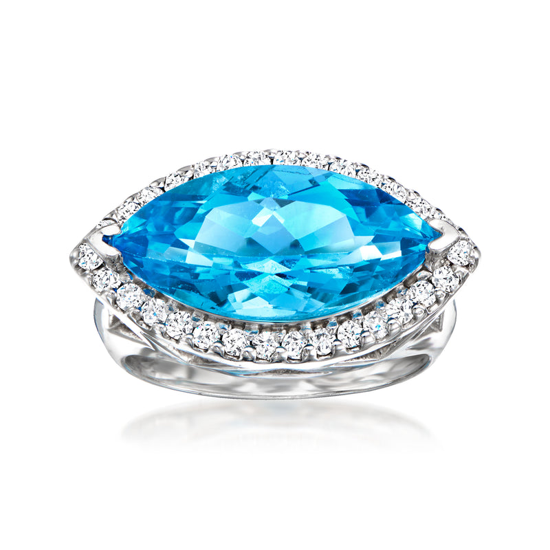 White gold ring with oval Swiss blue topaz and diamond halo