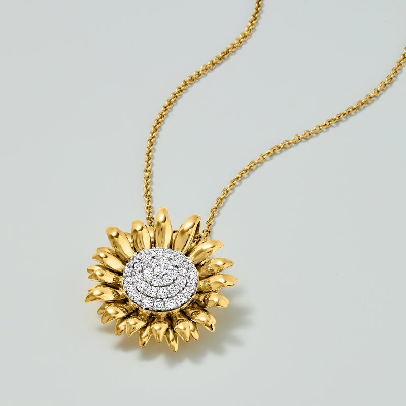 Gold sunflower pendant necklace with round diamond cluster center on chain