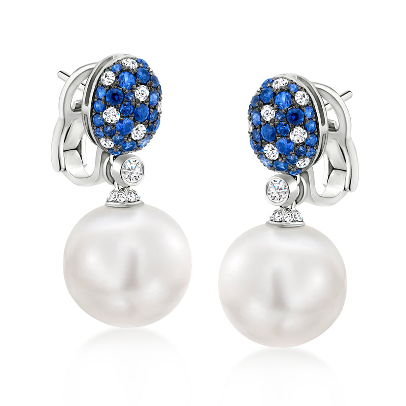 White gold pearl drop earrings with blue sapphire and diamond cluster tops