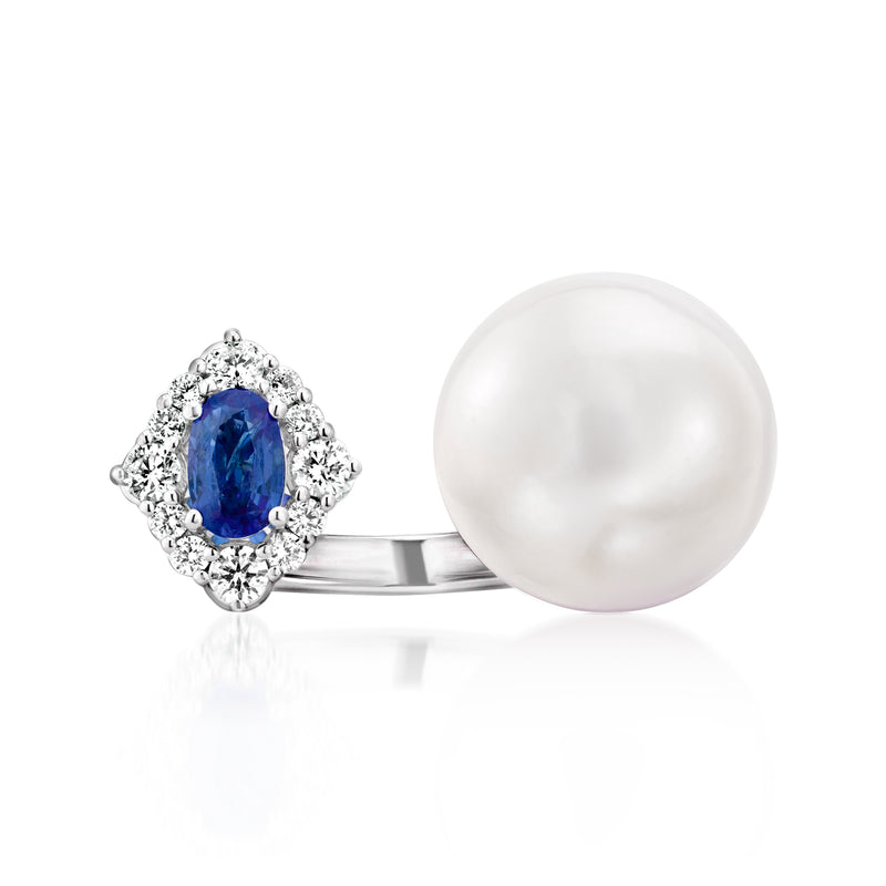 18kt white gold ring with blue sapphire, diamond halo, and round white pearl