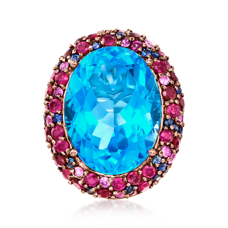 Oval blue topaz ring with pink and blue gemstone halo, rose gold