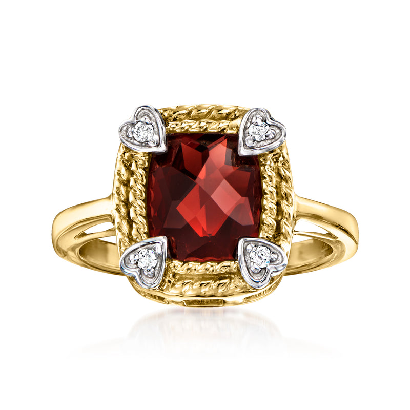14k yellow gold ring with red garnet centerpiece and four diamond accents