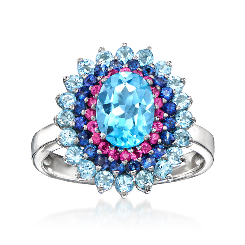 14kt white gold ring with blue topaz center, blue sapphires, and pink rubies halo